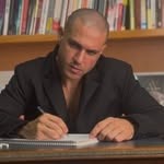 Jay, writing at his desk
